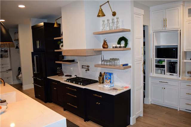 Painted cabinets - stained floating shelves - Quartz countertops and backsplash